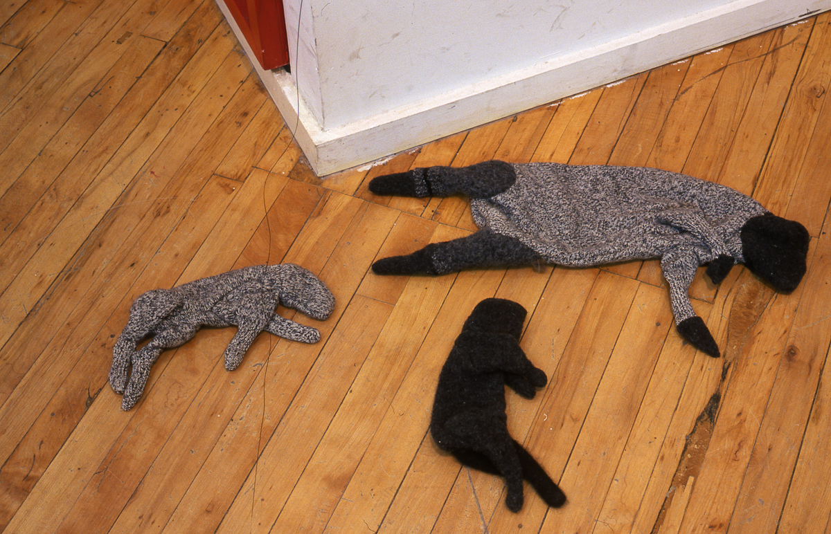 Installation view of the group show trophy. textile sculptures displayed on the ground.