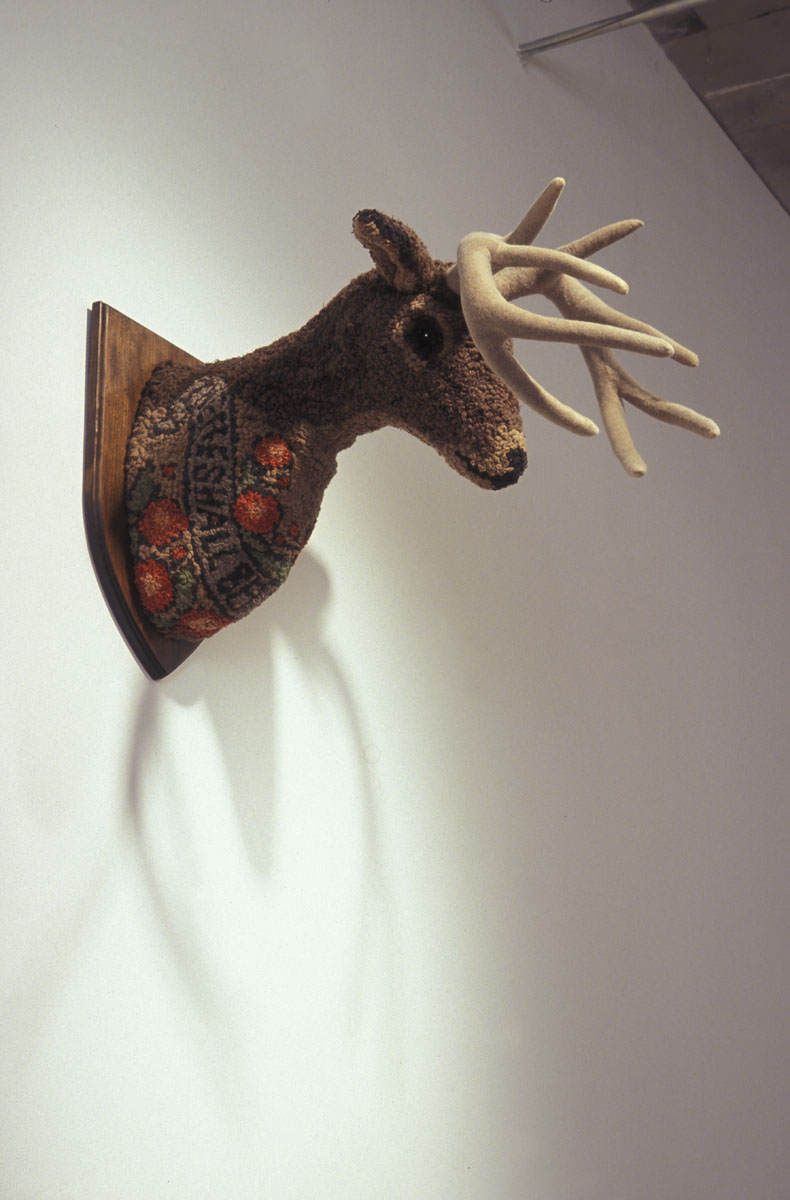 Heather Goodchild, sculpture of a deer head, mounted on the wall.