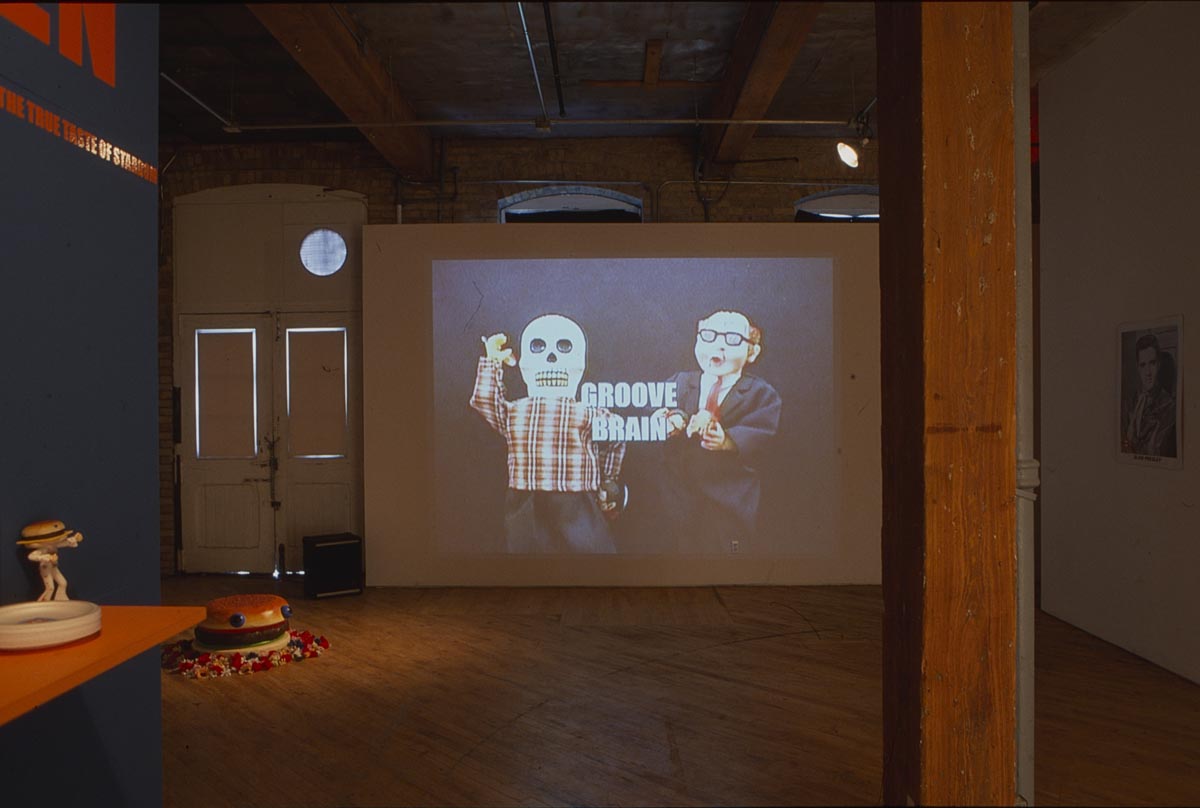 Burgerheaven: Installation View: Projection, hamburger sculpture.