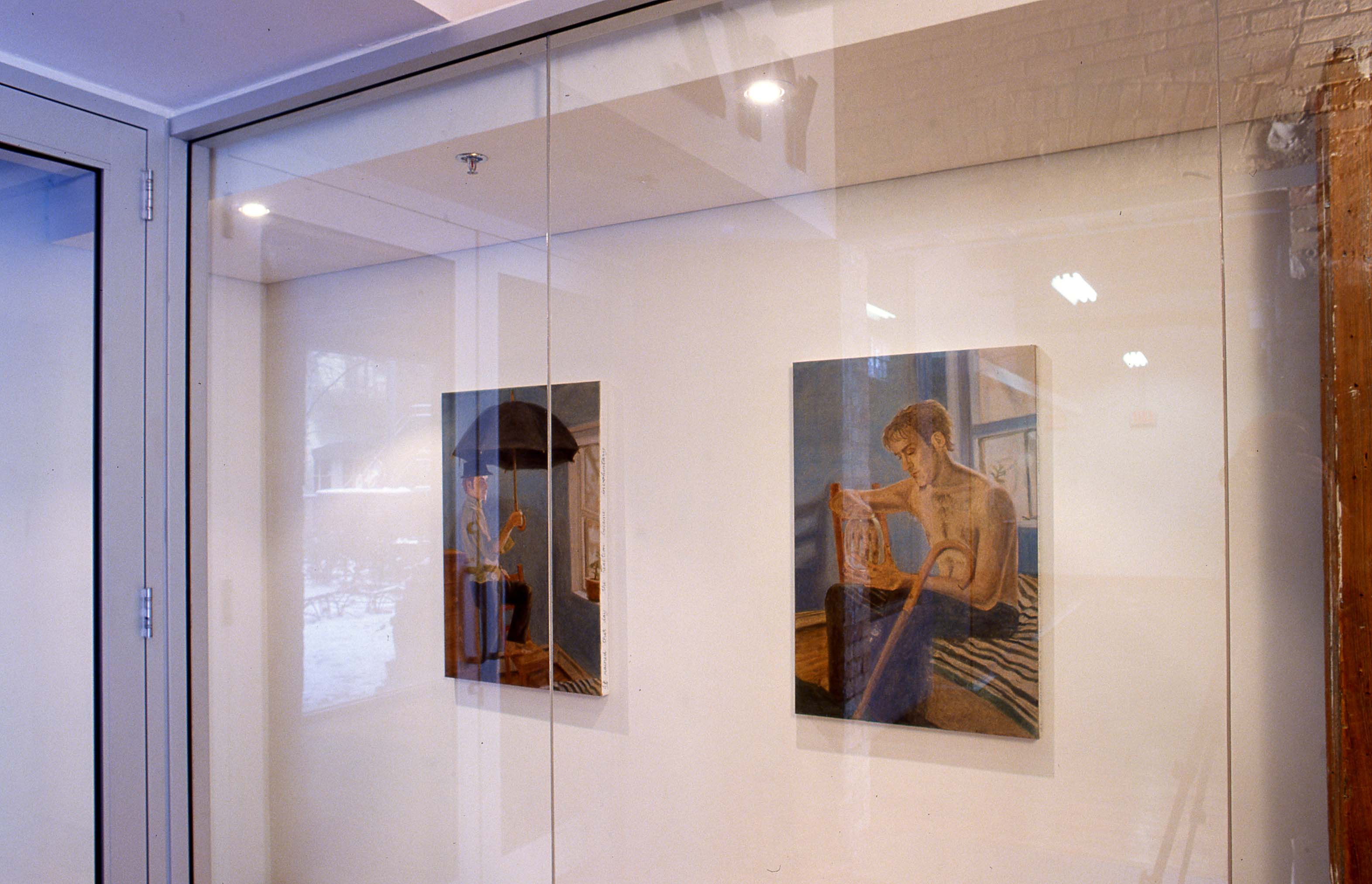 MOSBY: Paintings hanging in the window of the gallery.