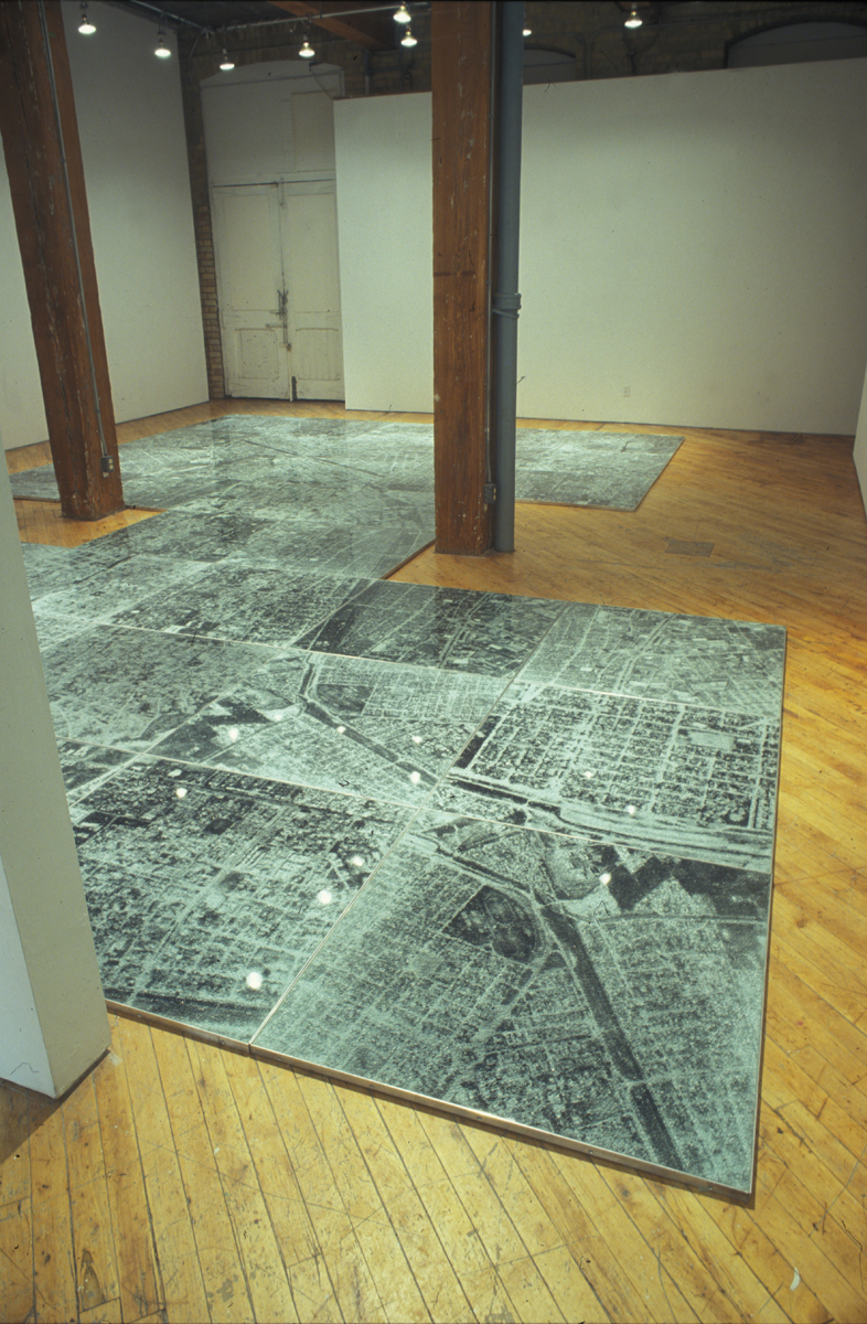 Oscar Munoz: Installation view.He experiments with several techniques in what he refers to image-making in an expanded field, innovating processes on improbable substrates, including silk-screen on water, airbrush drawing on dripping-wet Mylar, and screen-printing with grease on mirrors.