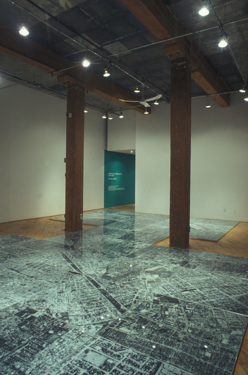 Oscar Munoz: Installation view.He experiments with several techniques in what he refers to image-making in an expanded field, innovating processes on improbable substrates, including silk-screen on water, airbrush drawing on dripping-wet Mylar, and screen-printing with grease on mirrors.