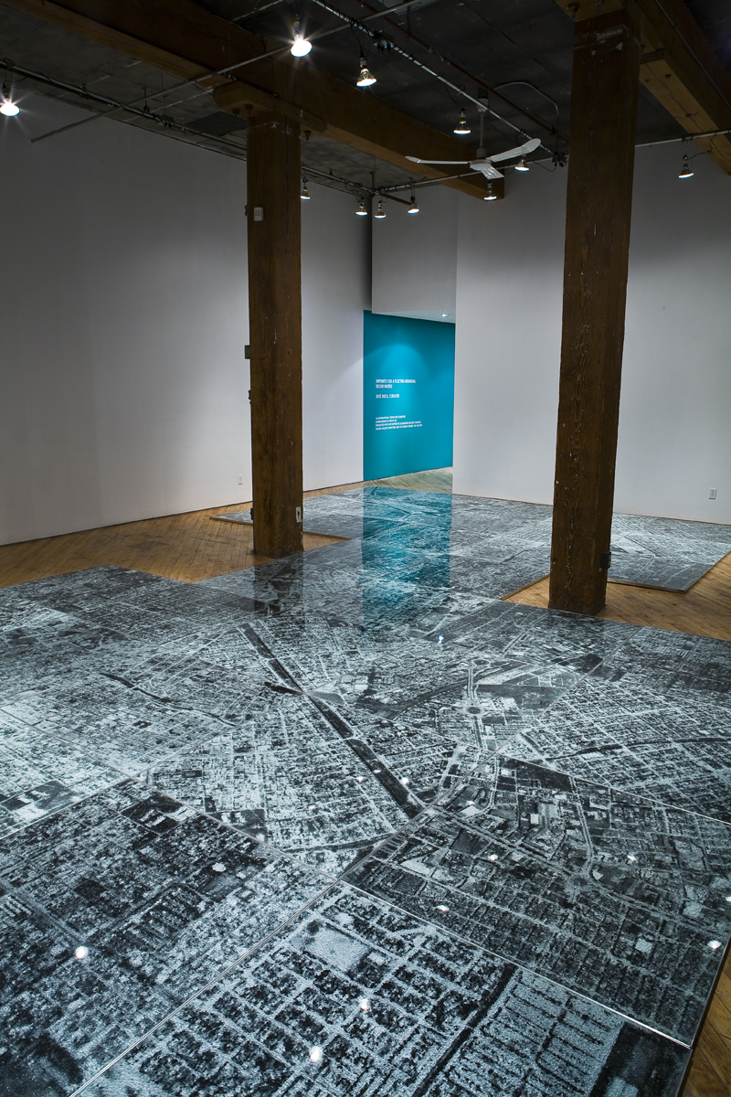 Oscar Munoz: Installation view.He experiments with several techniques in what he refers to image-making in an expanded field, innovating processes on improbable substrates, including silk-screen on water, airbrush drawing on dripping-wet Mylar, and screen-printing with grease on mirrors.