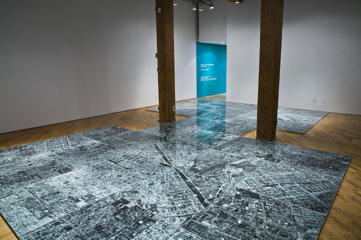 Oscar Munoz: Installation view.He experiments with several techniques in what he refers to image-making in an expanded field, innovating processes on improbable substrates, including silk-screen on water, airbrush drawing on dripping-wet Mylar, and screen-printing with grease on mirrors.