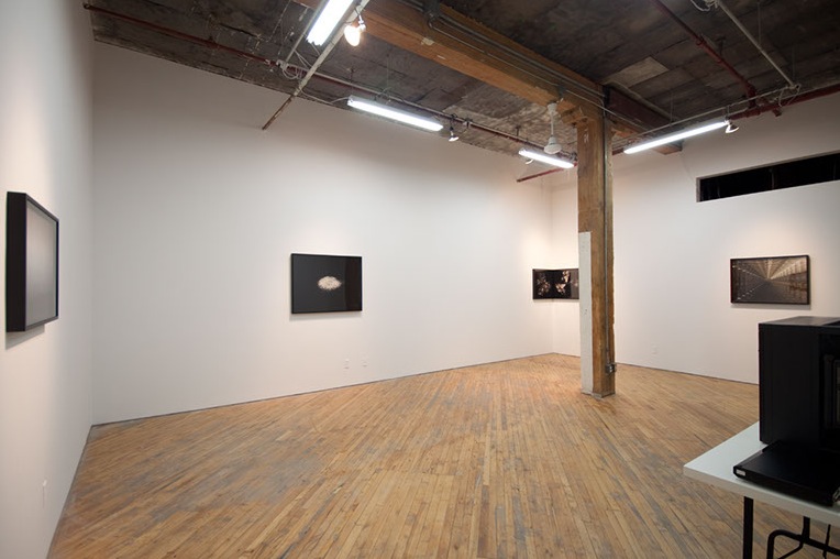 Lorna Bauer, installation view, images of broken glass, and multiple exposure photographs.