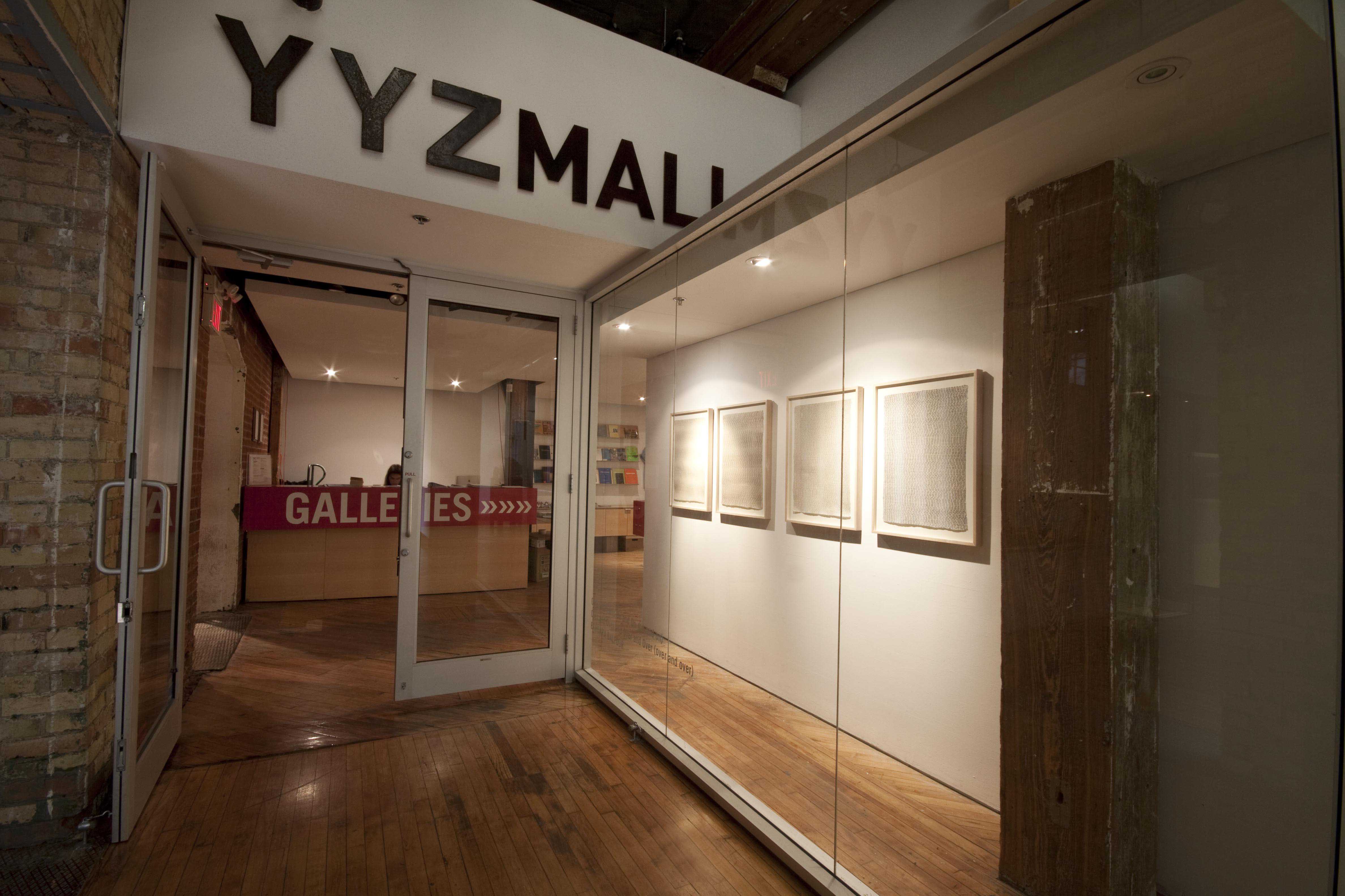 Barbara Balfour, installation view of Living and Dying, window: images of writing hang in the window gallery.