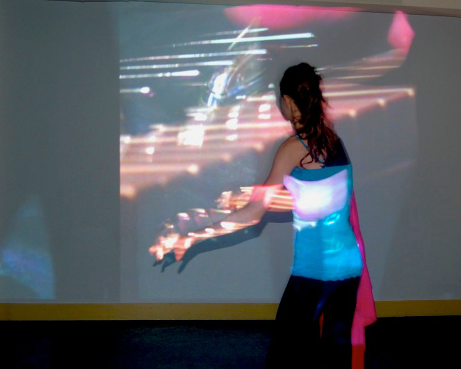 Ashley Guindon, image of projection, person standing in front of the image.