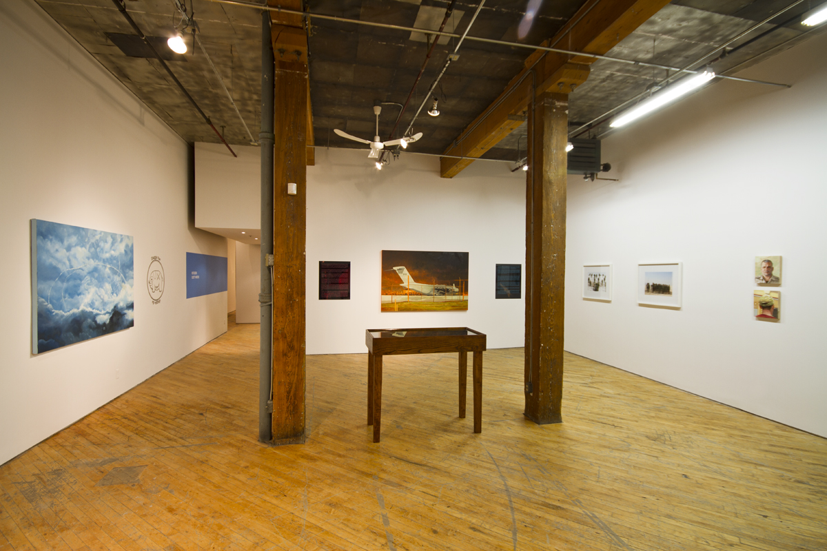 Scott Waters: Installation view, oil on canvas., table with artifacts
