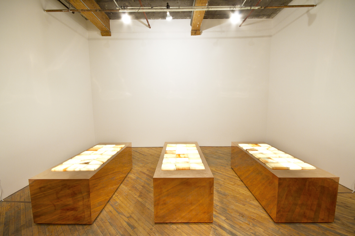 Faith La Rocque, installation view, three copper plinths aligned in a row, with Himalayan salt layered on top, create a sensory experience.