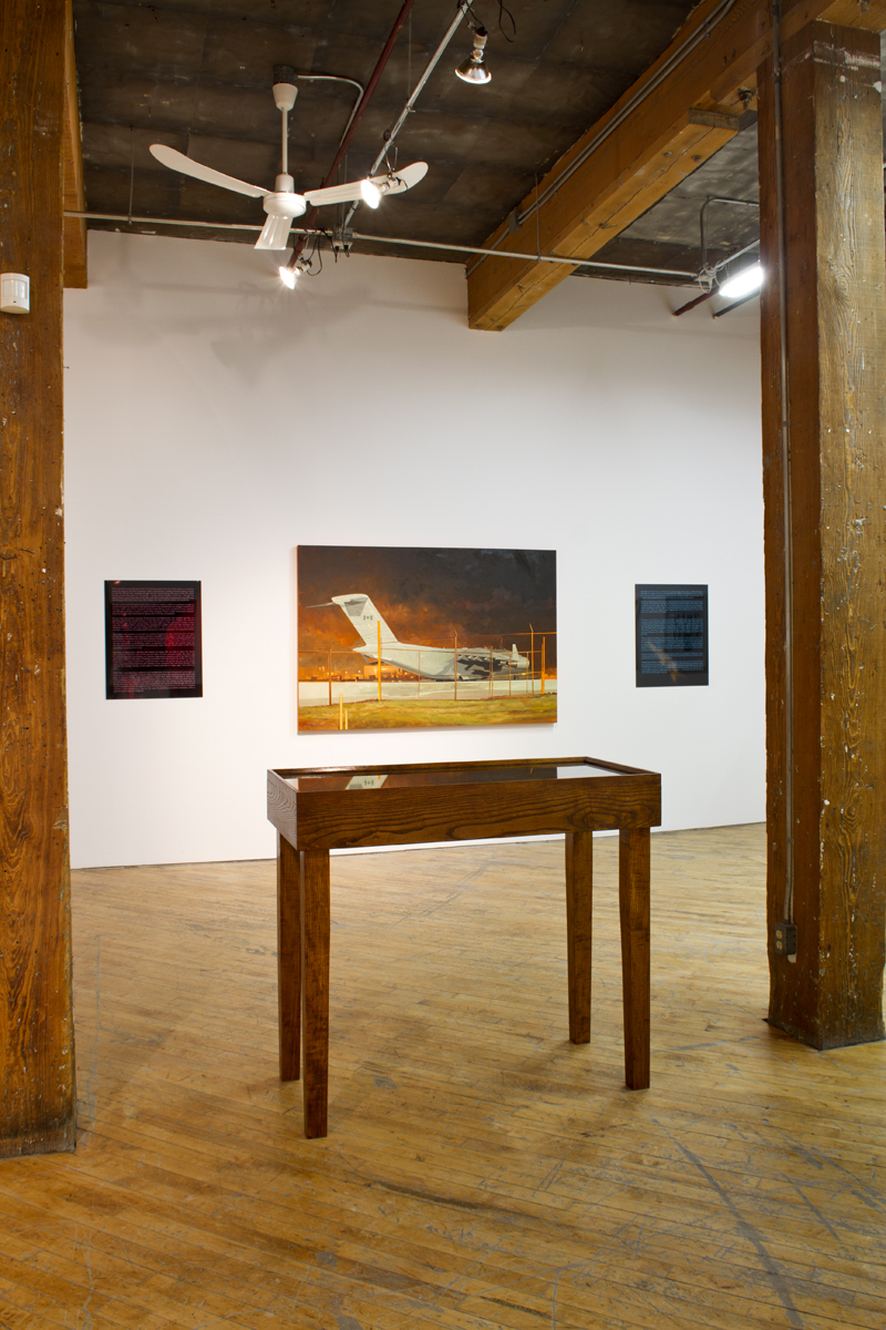 Scott Waters: Installation view, oil on canvas., table with artifacts