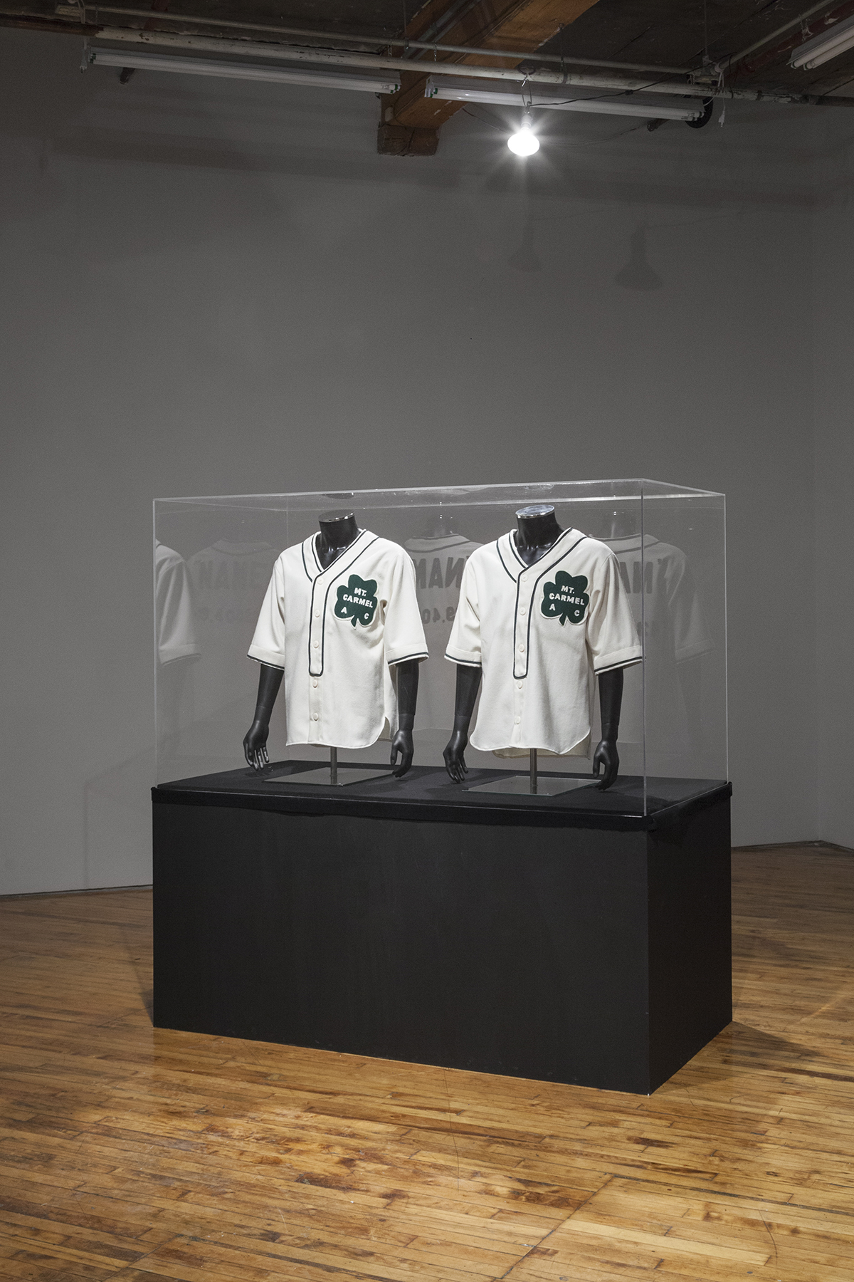 Jalani Morgan, explores two Black baseball players that played for the local Mount Carmel Church team in 1942, baseball uniforms.