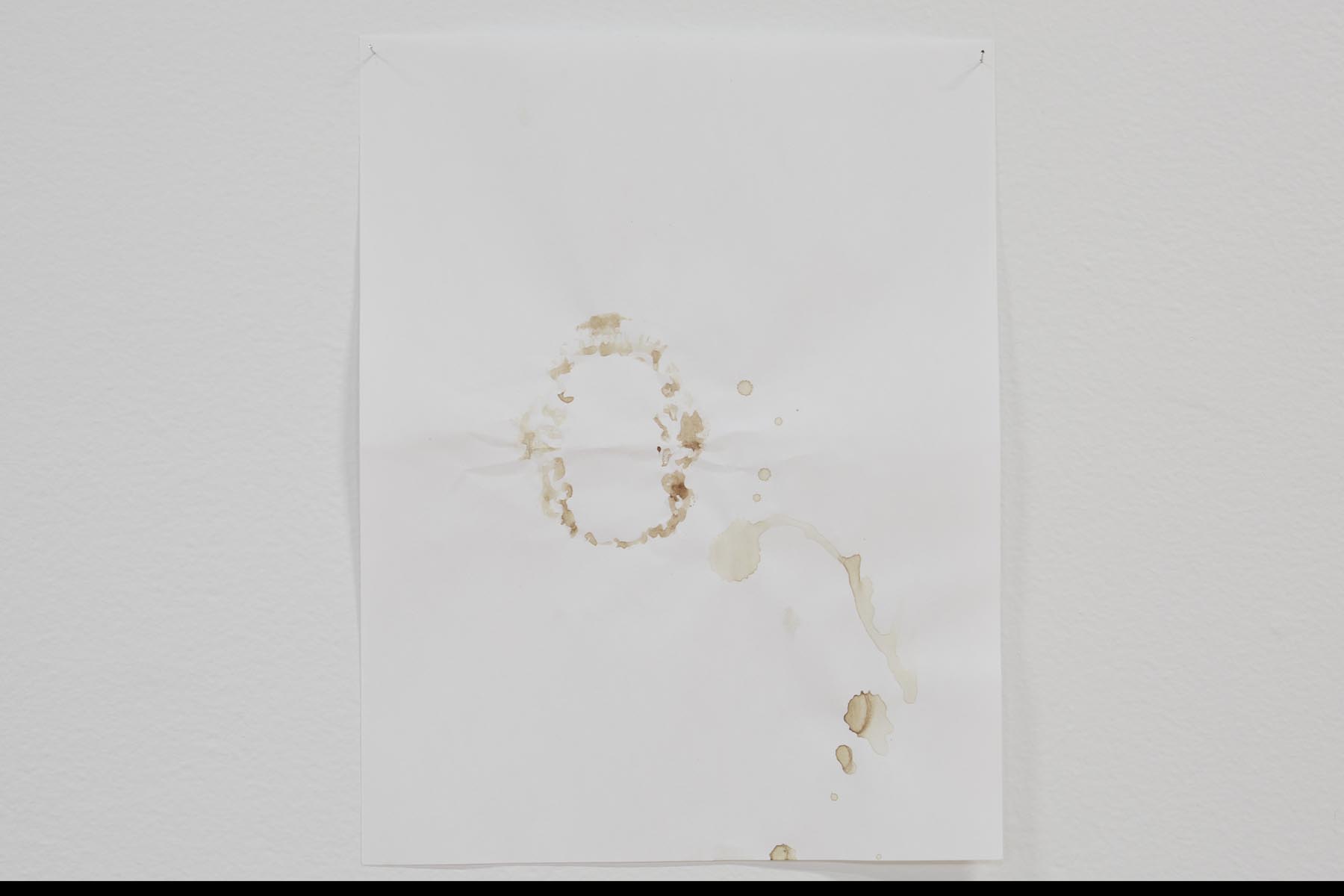 Gustavo Artigas, a series of abstract drawings made on simple Letter white bond sheets, hanging from the walls, delicately sustained by pins