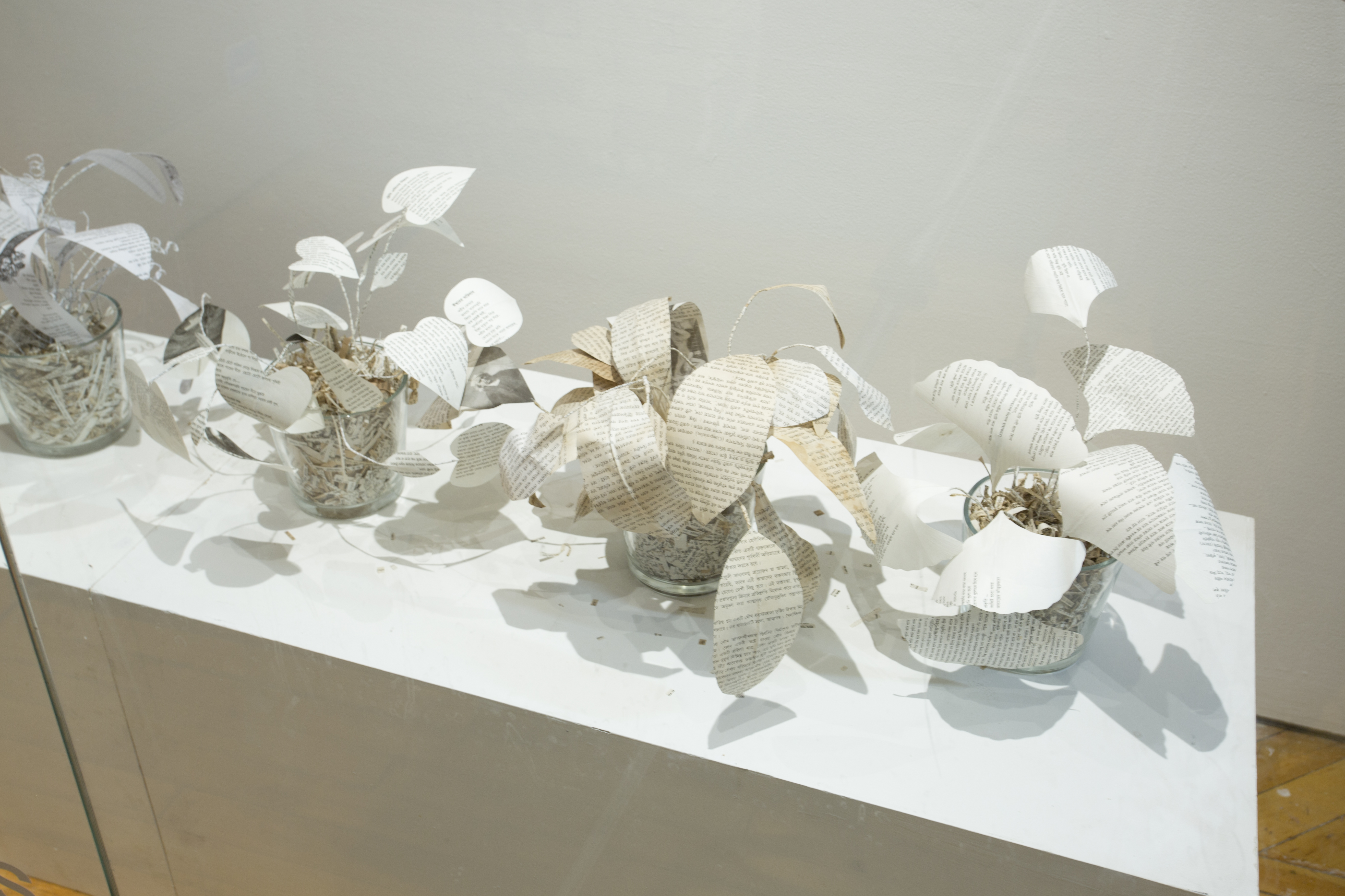 Asma Sultana, window installation, paper sculptures created with printed paper from books.