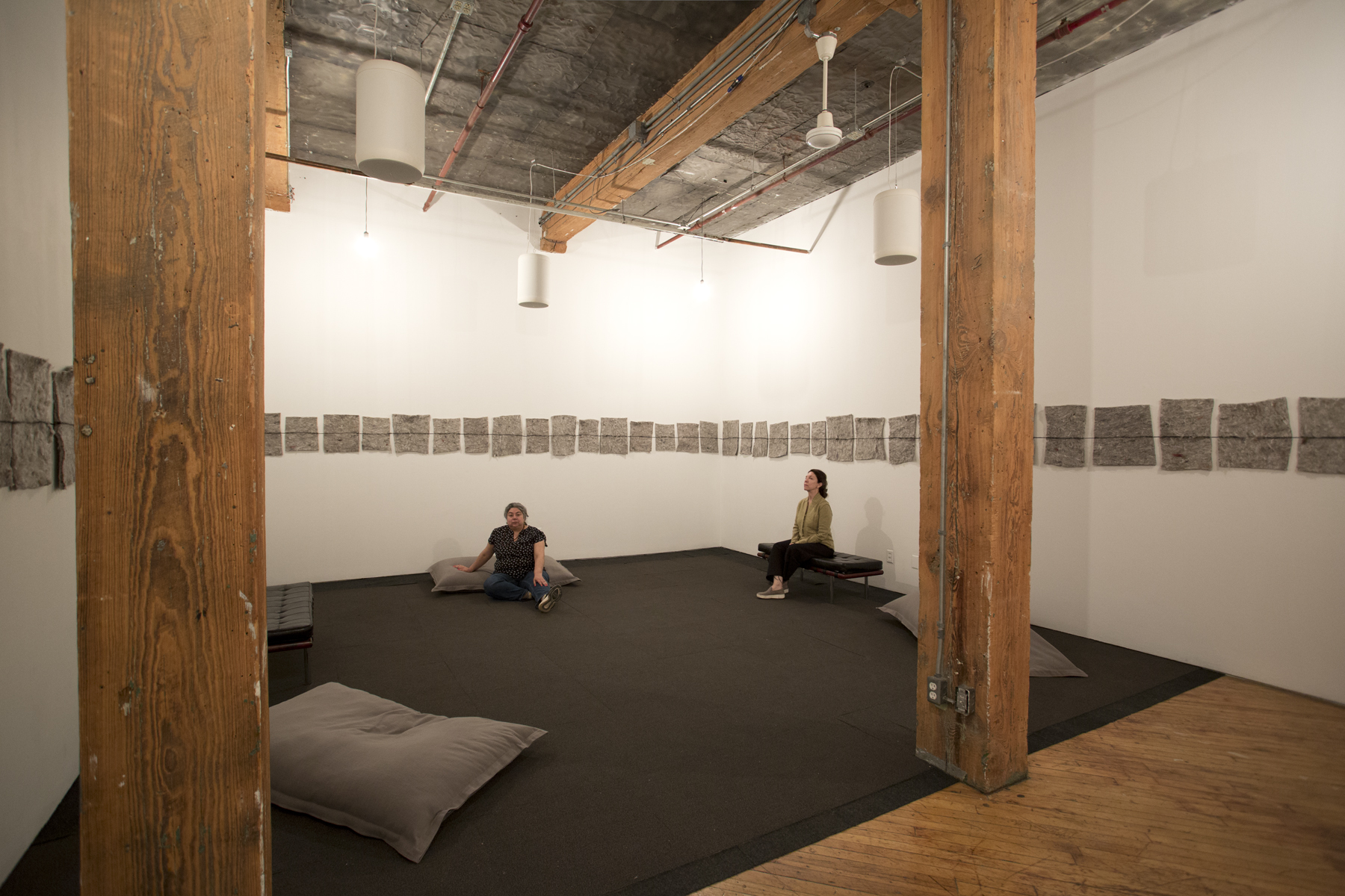 Installation view: immersive listening and resting zone that combines audio and art.