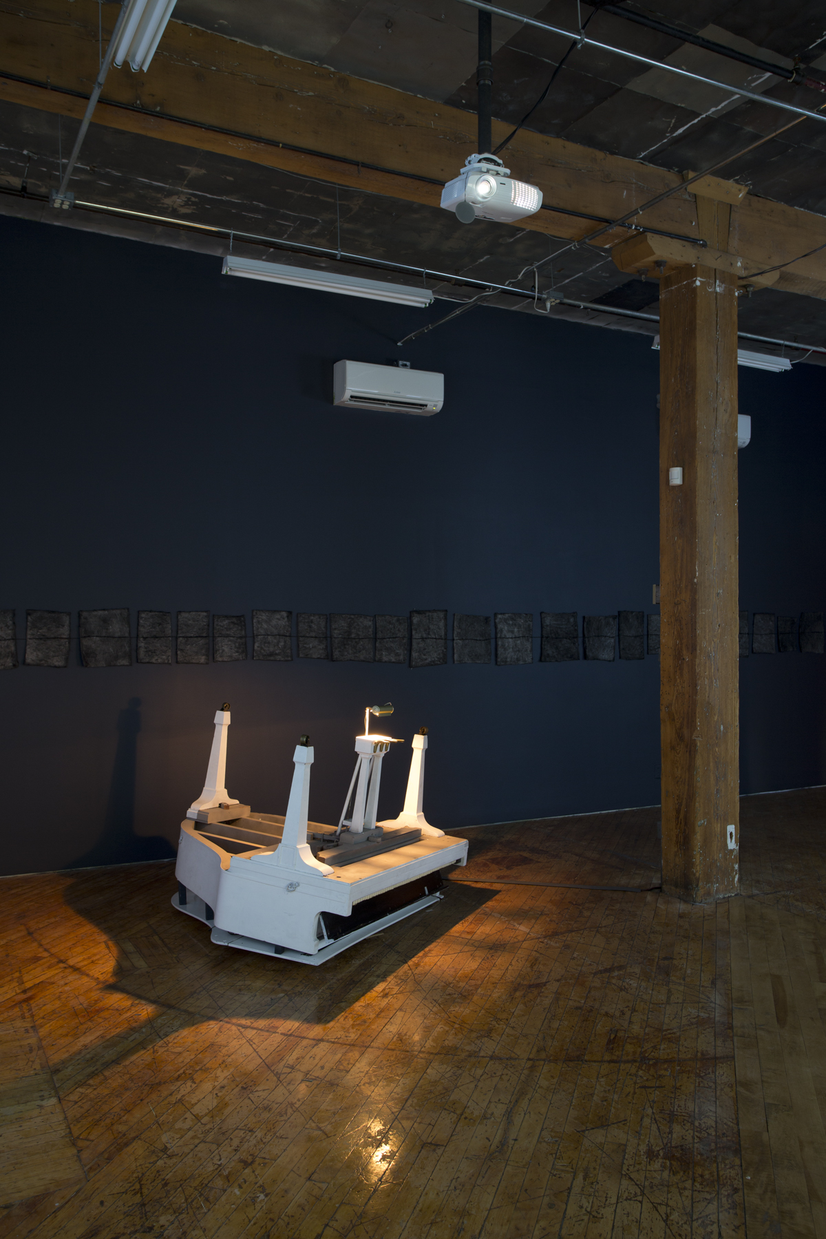 Installation View: The South Gallery, Arrivals, features work of four video artists, projections and upside down piano
