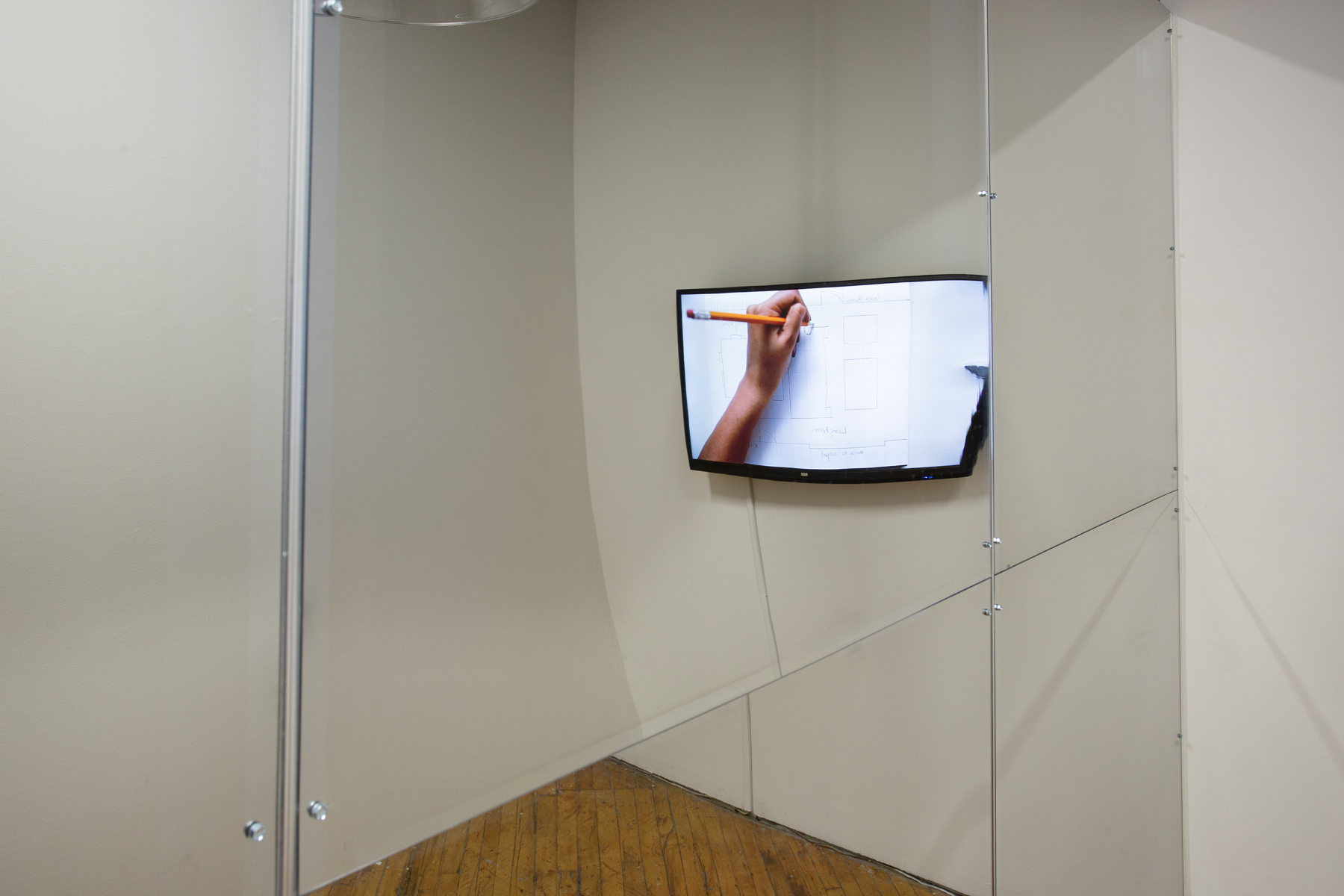 Zinnia Naqvi, view of installation, mirror and monitor.