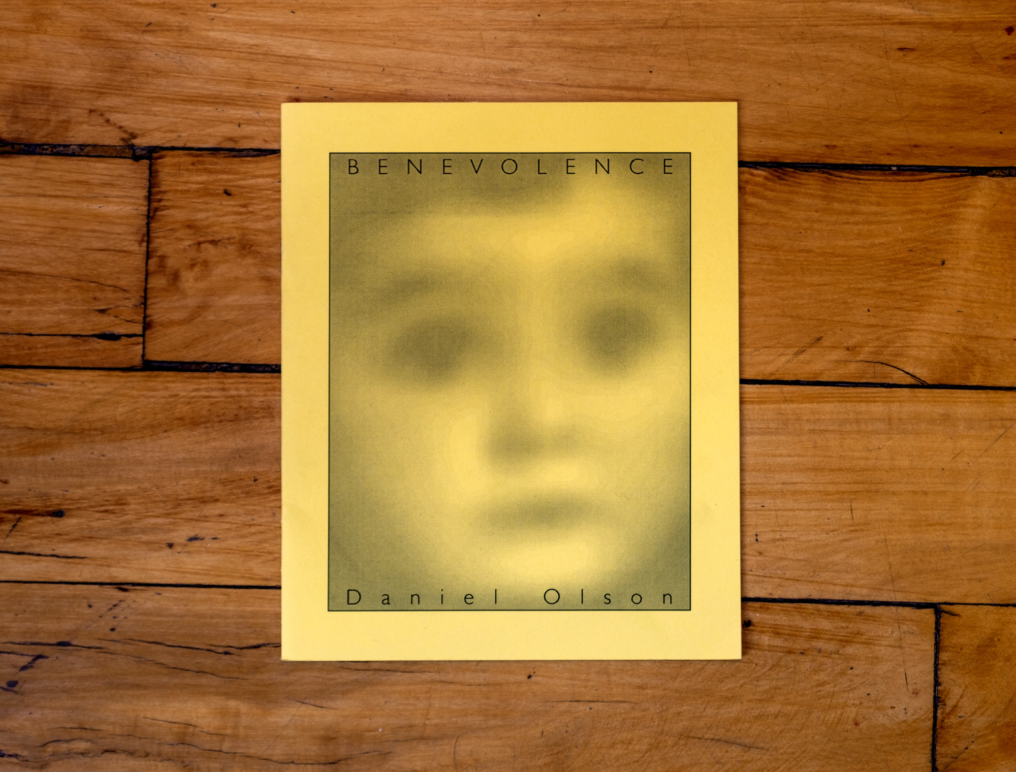 A yellow duotone image of an obscured child's face titled 