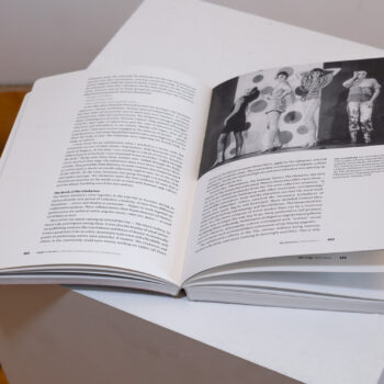 Inside spread of an exhibition brochure with black and white text and photography