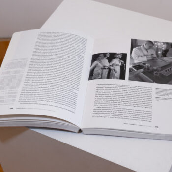 Inside spread of an exhibition brochure with black and white text and photography