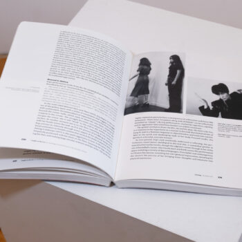 Inside spread of an exhibition brochure with black and white text and photography