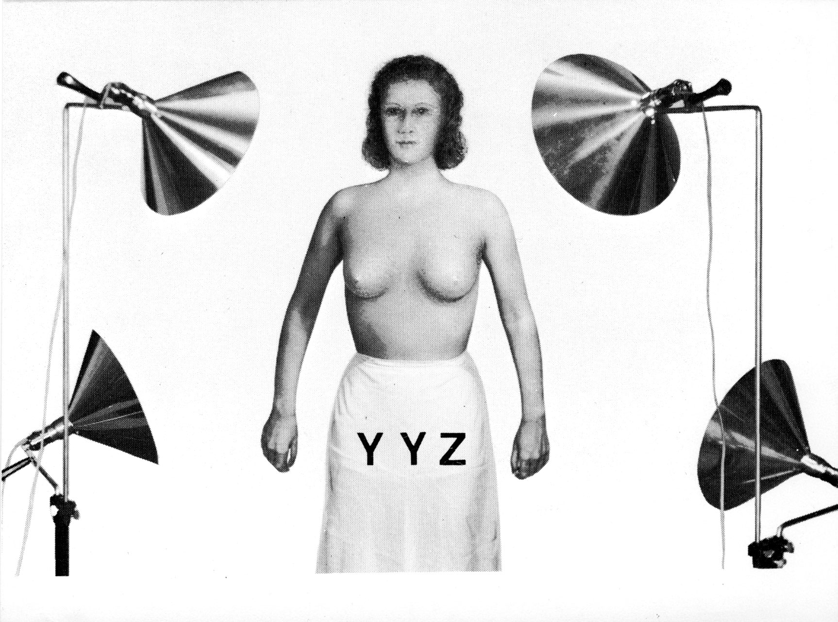 Scanned black and white collage of a feminine figure, pot lights and YYZ logo