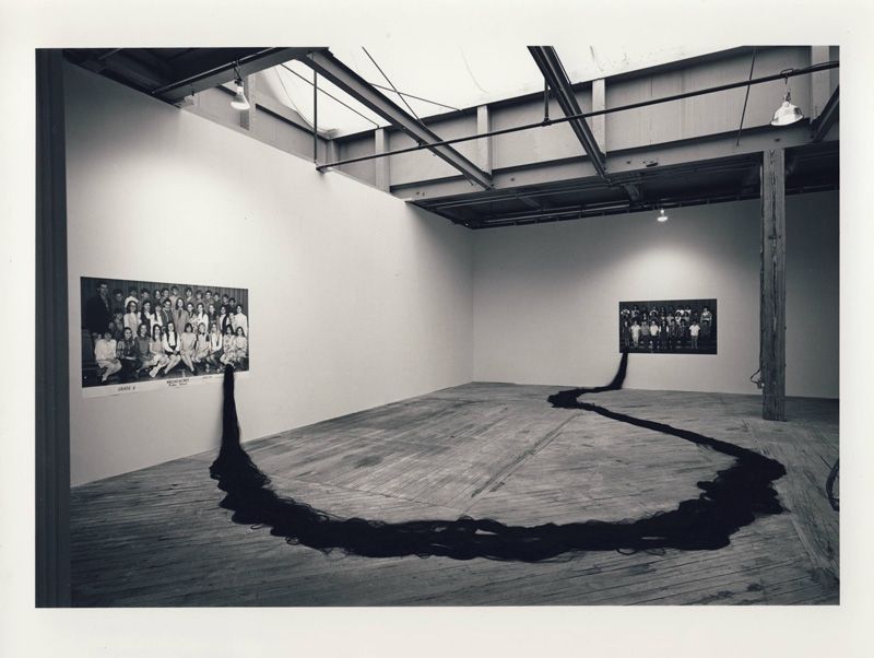 An archival black and white image of an exhibition install