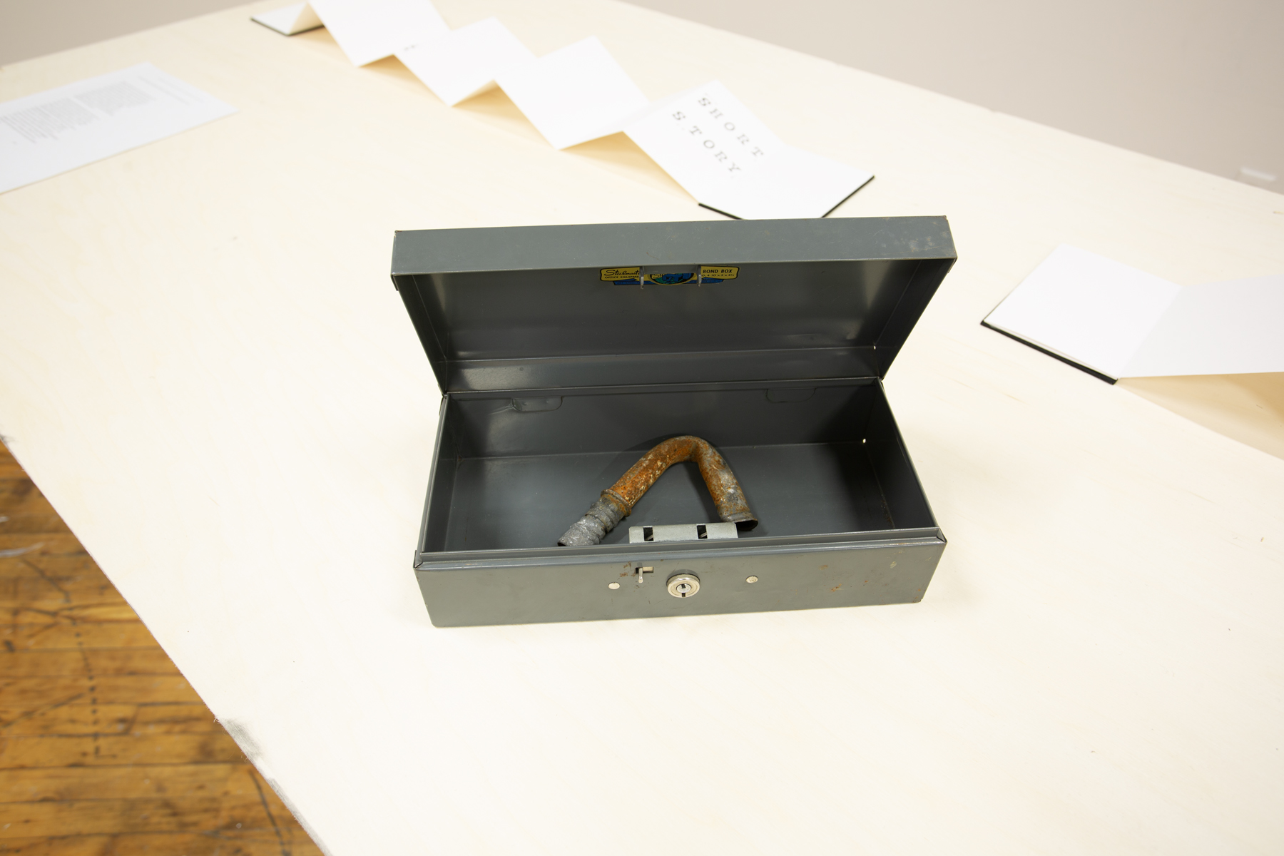 Yusuf Hassan, installation view, table with object displayed.