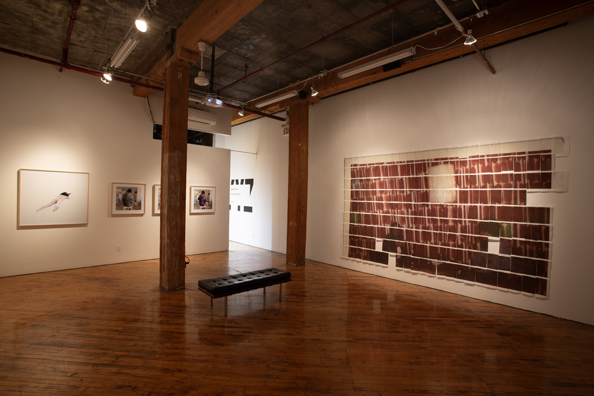 Jake Kimble: Installation view, large mural printed on paper towels, layer out in a grid formation
