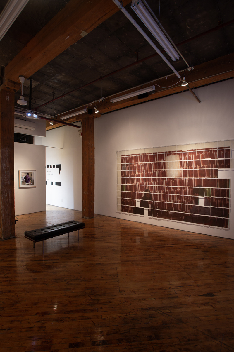 Jake Kimble: Installation view, large mural printed on paper towels, layer out in a grid formation