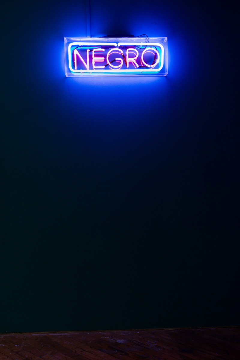 Oluseye: Installation view NEGRO florescent sign..