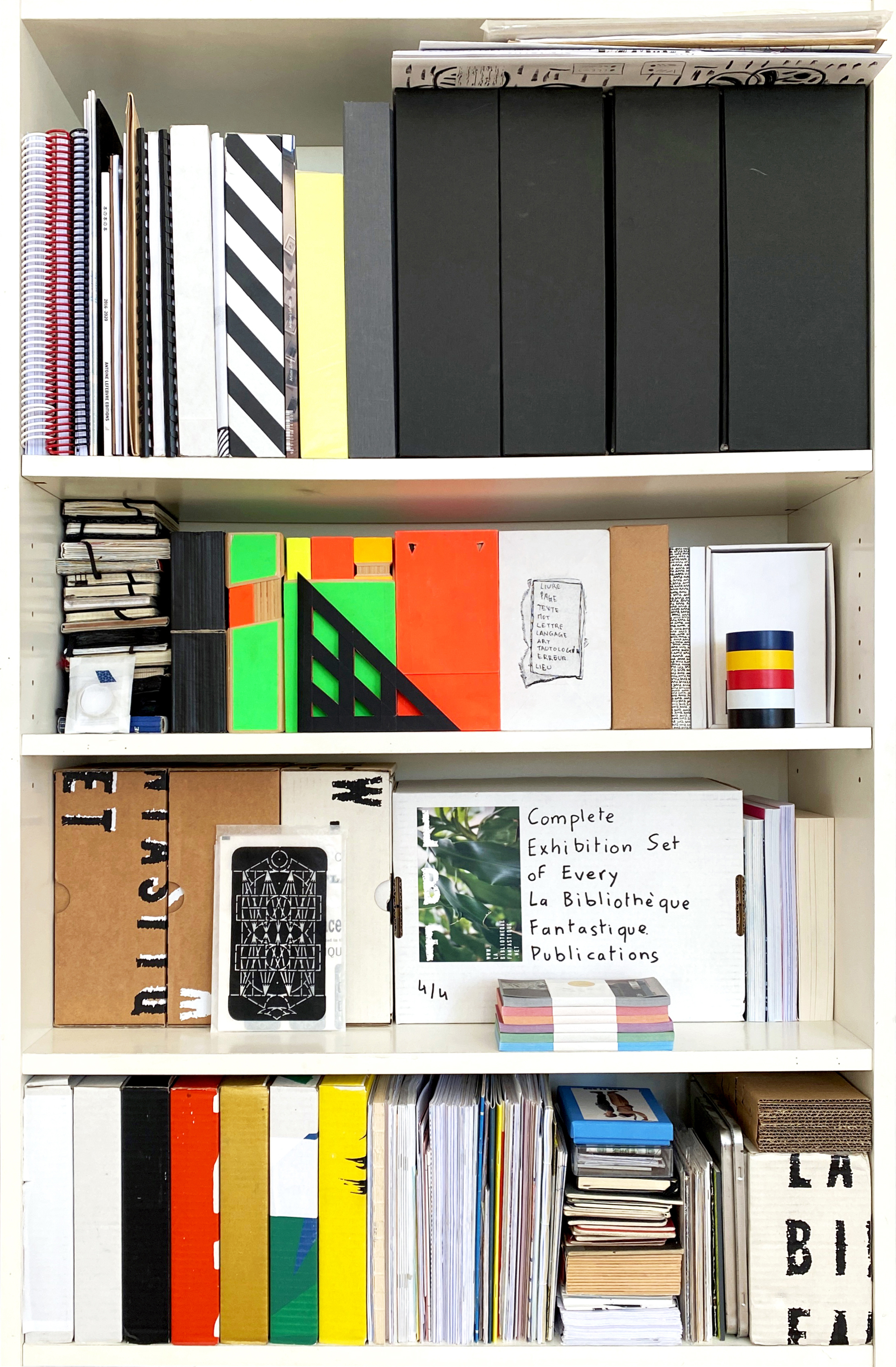 A bookshelf with many books.