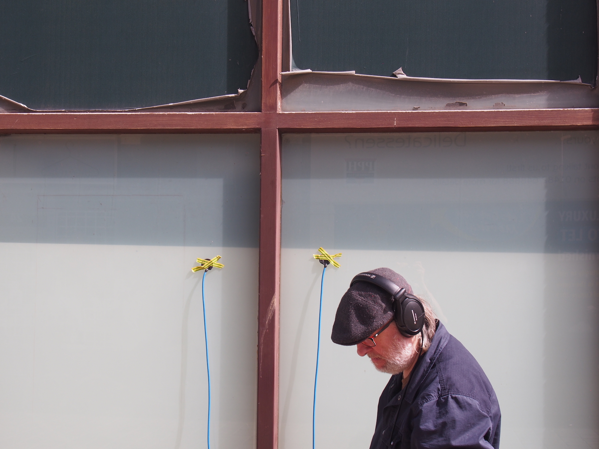 Man listens to recording on headphones