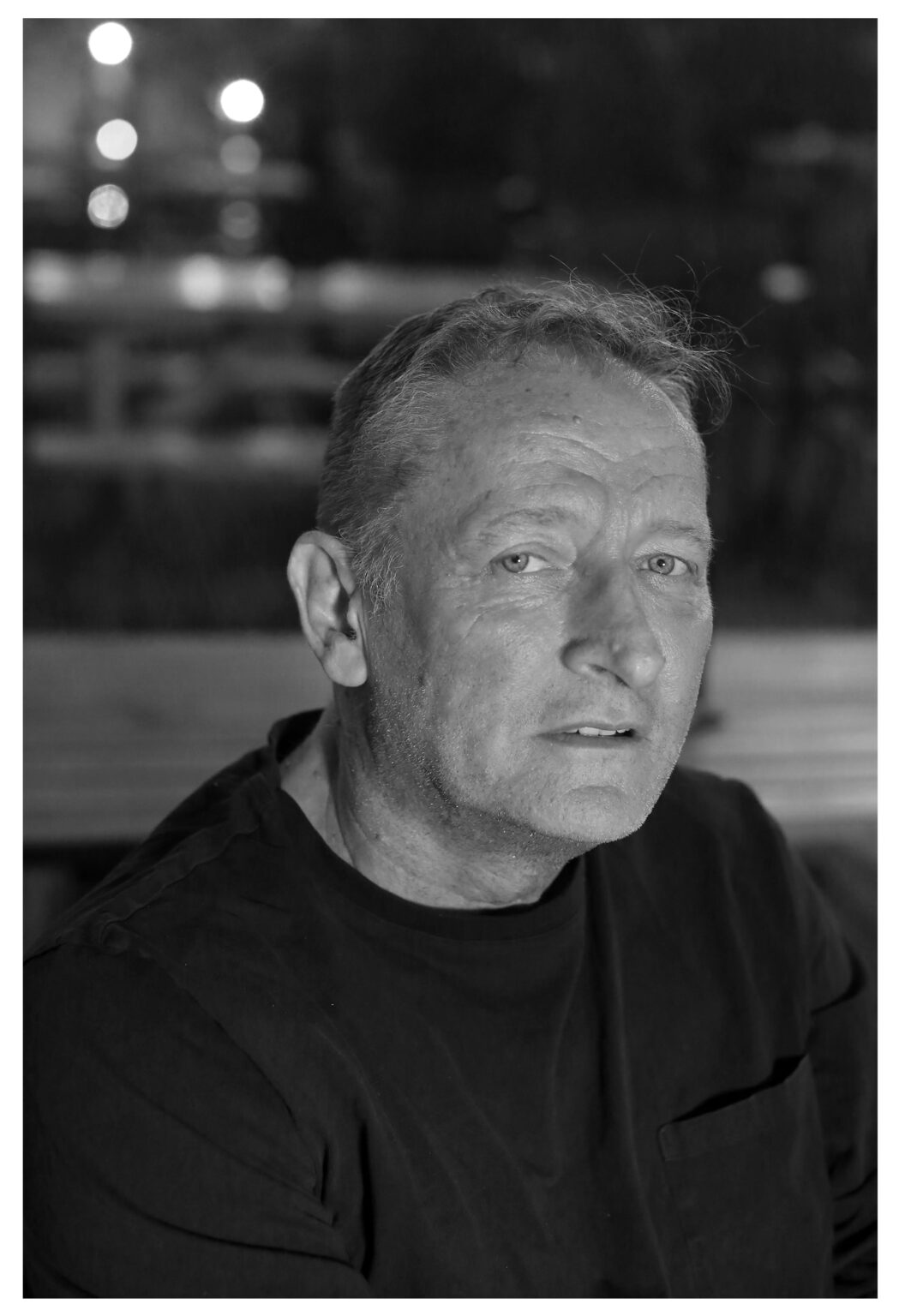 Portrait of the artis looking straight into the lens wearing a black sweater