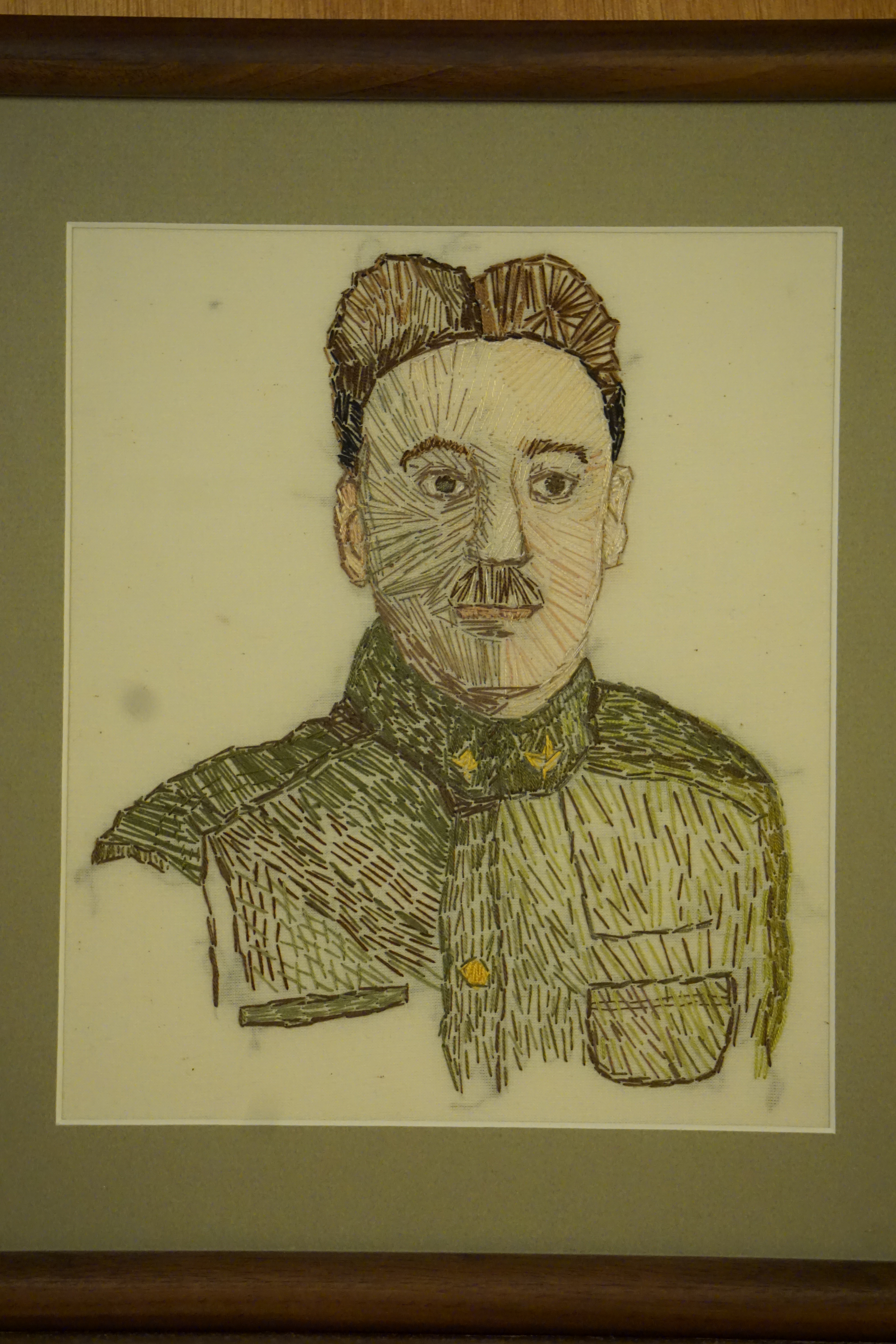 Embroidered portrait of man